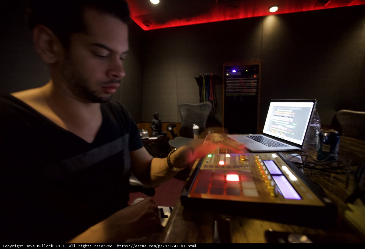 Marc Kinchen working on music with his laptop in the studio
