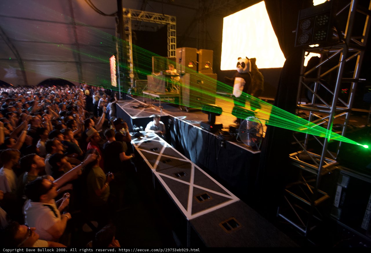 Green Laser Lights Illuminate the Crowded Concert