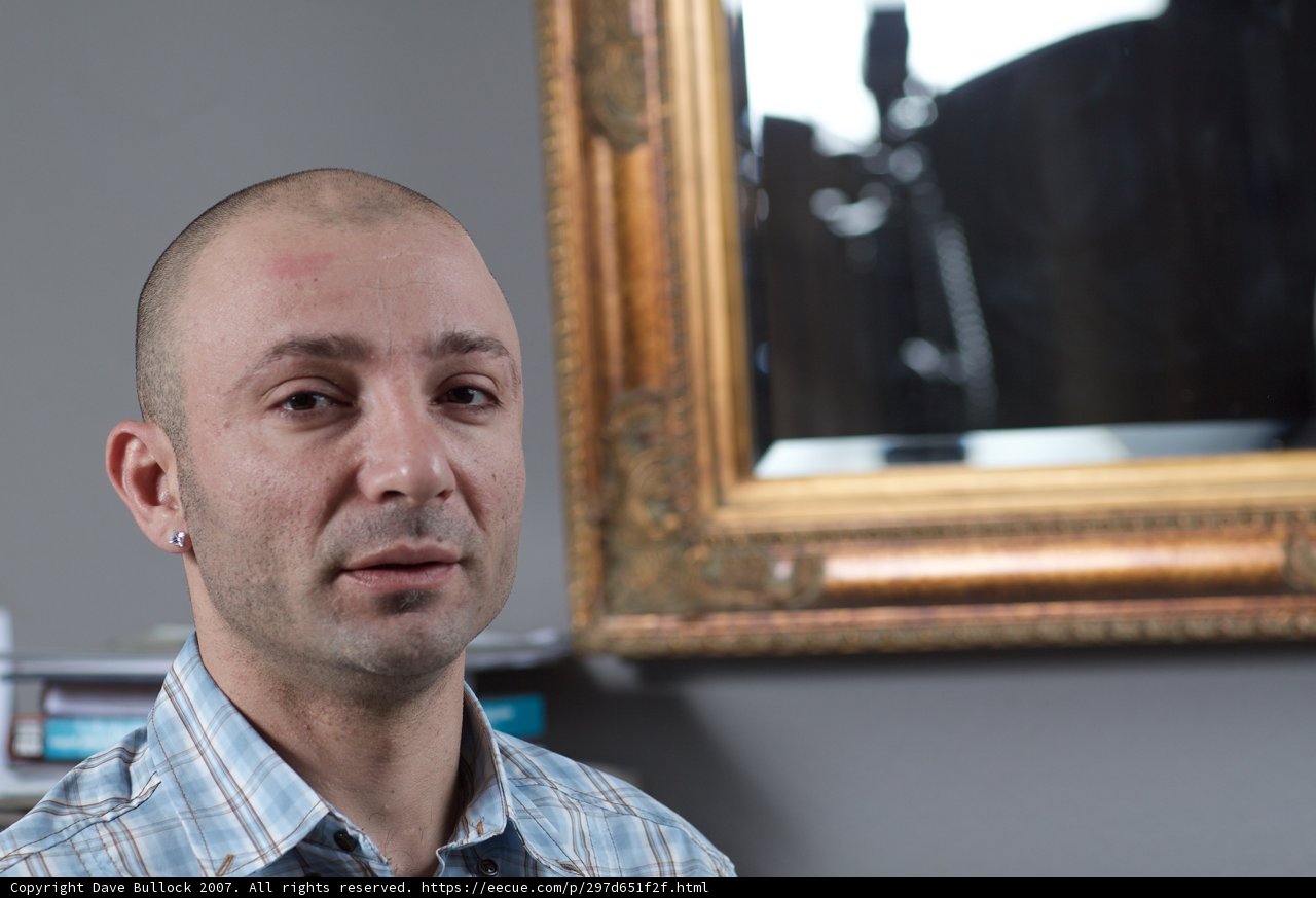 Bald Man in Plaid Shirt