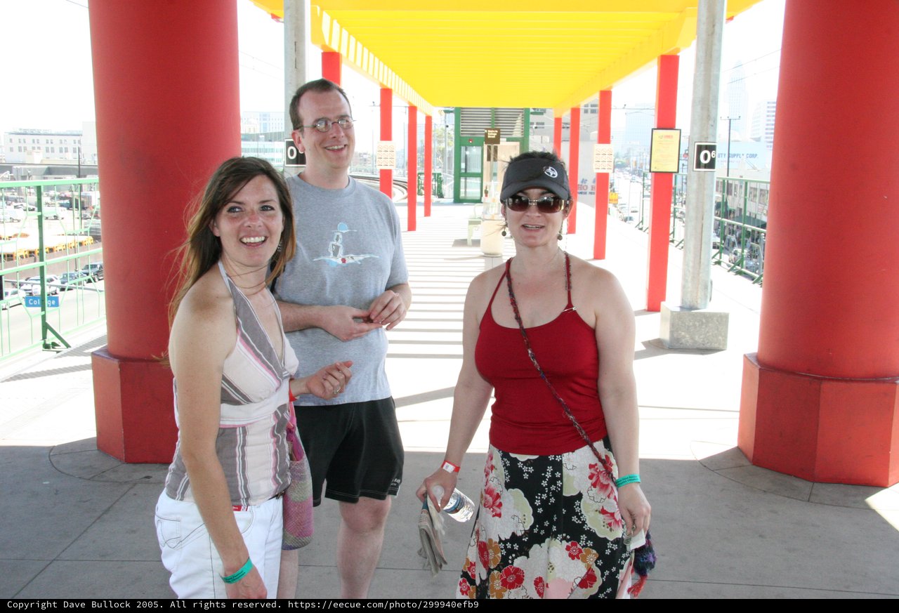 Three Friends at Colorful Transit Station Canopy
