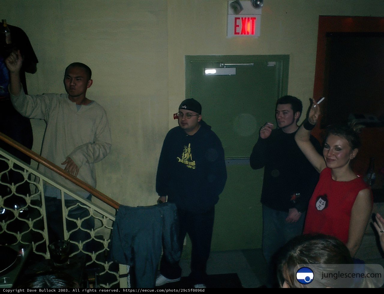 A Group Gathering by the Door