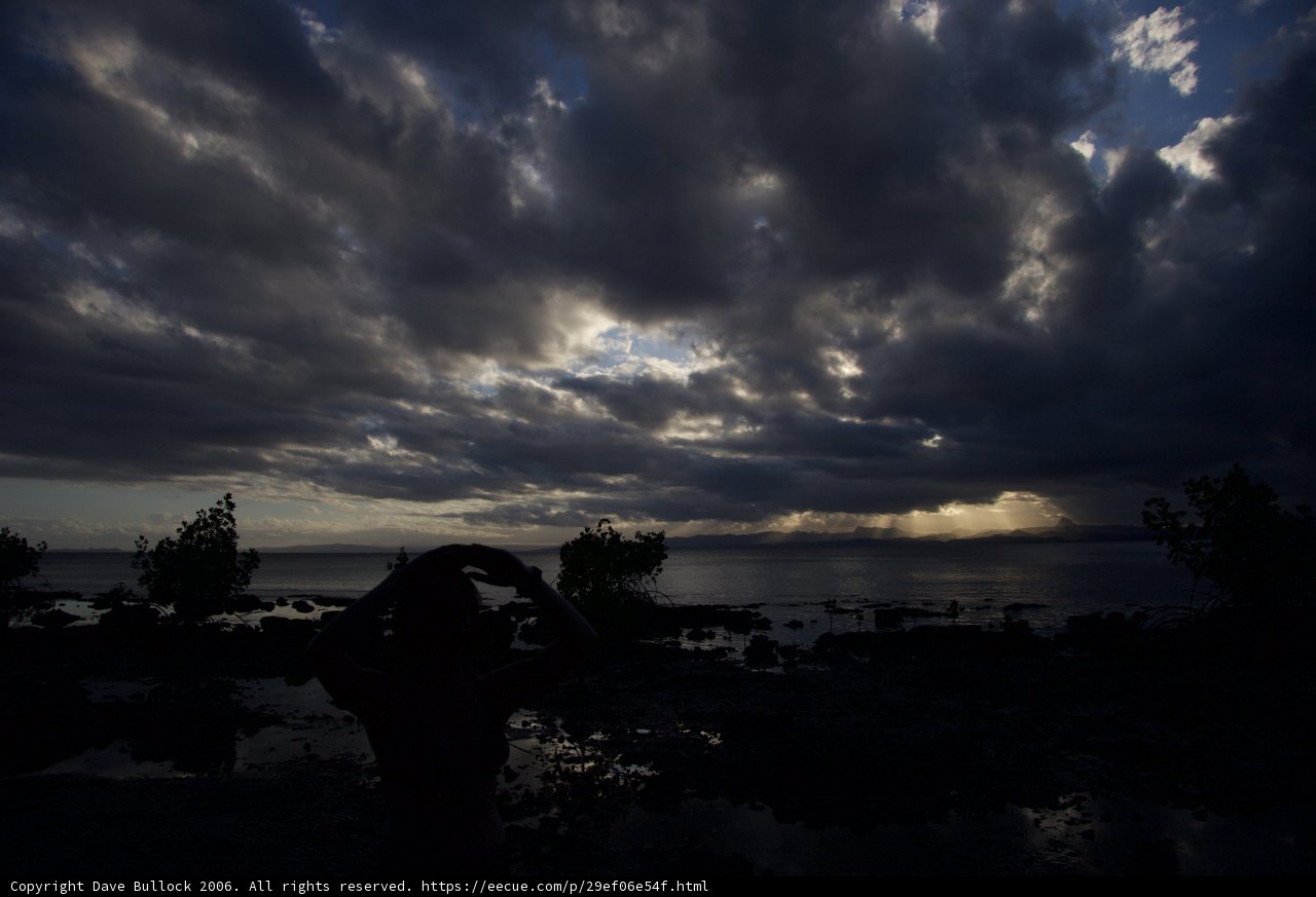 Silhouette of a lone figure against a dramatic sky