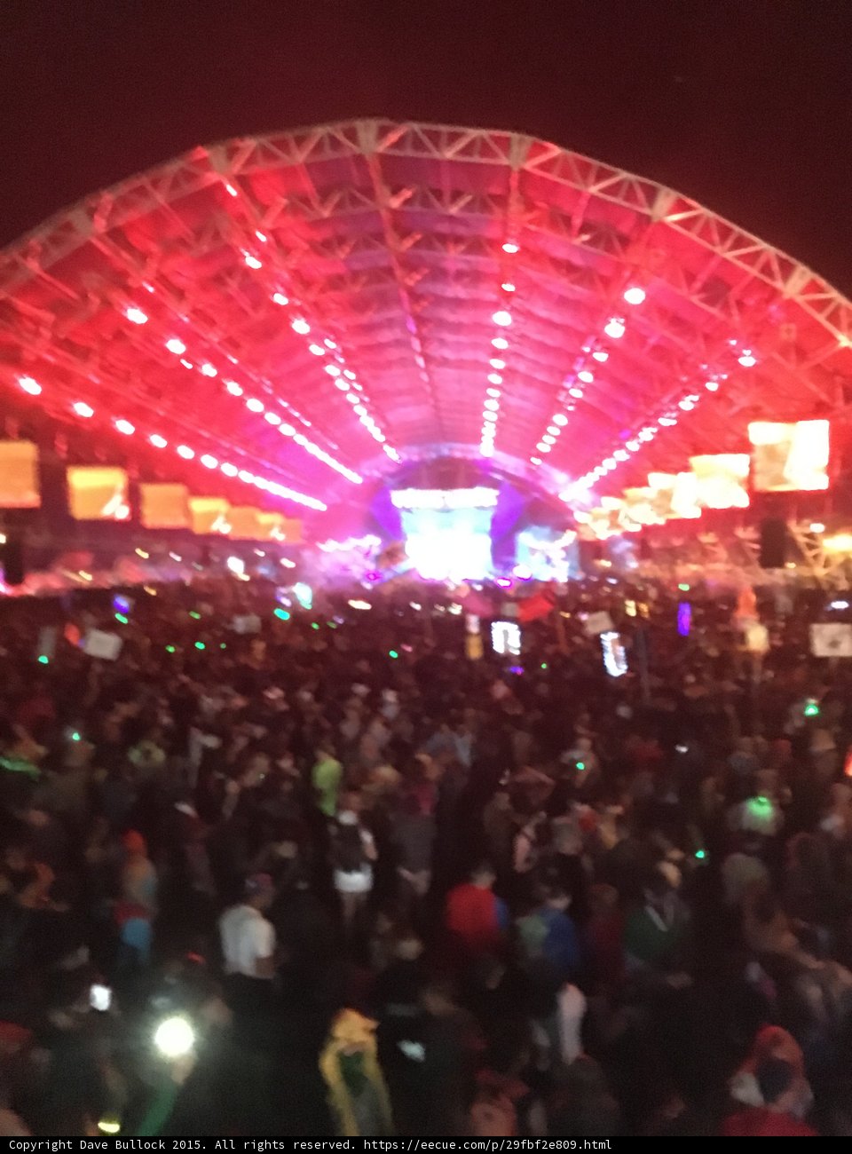 Red-Lit Partygoers Rock Out at San Bernardino Concert