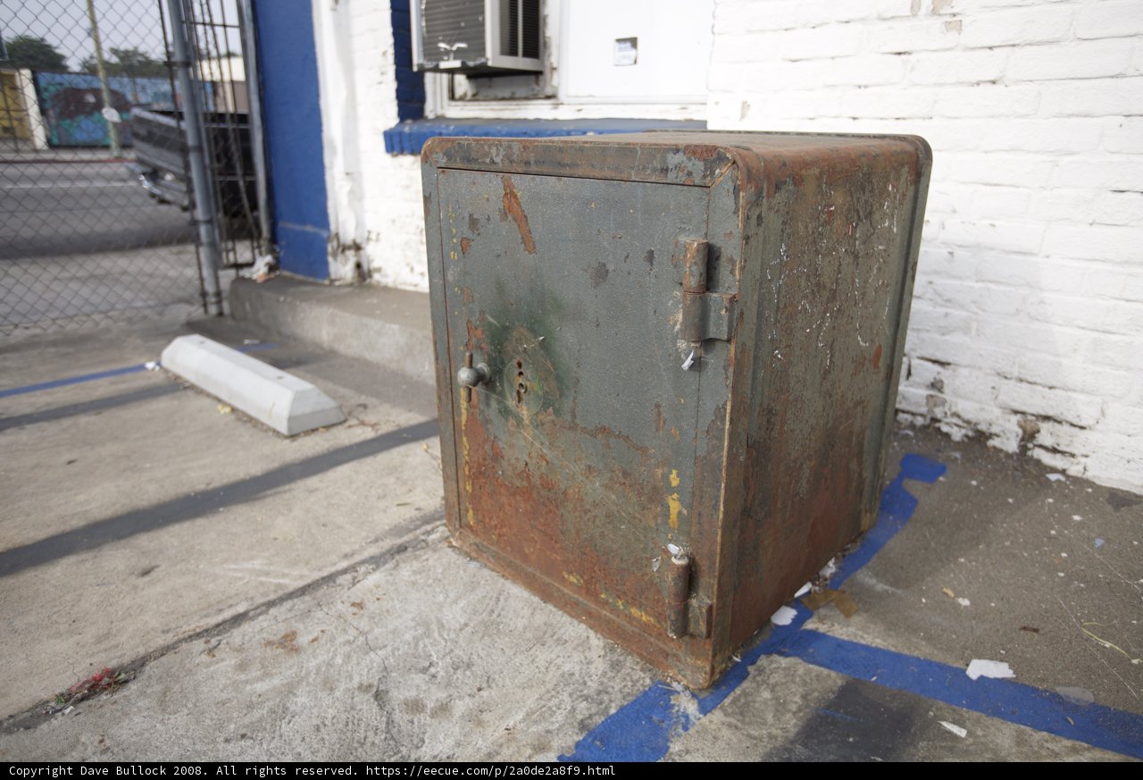Abandoned Safe on Sidewalk