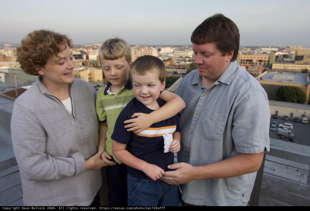 Family Moment on Urban Rooftop at Dusk