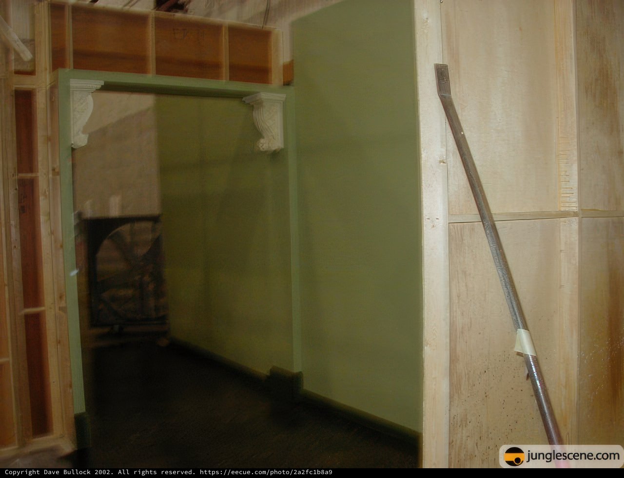 Open Door with Broom in Plywood Room