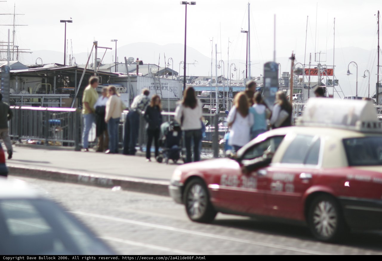 Red Coupe Parked by the Waterfront