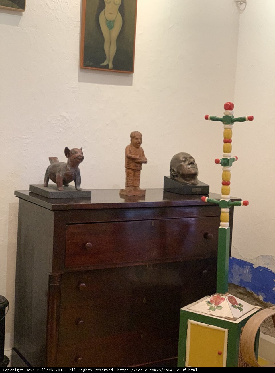 Wooden Chest and Statue on Dresser