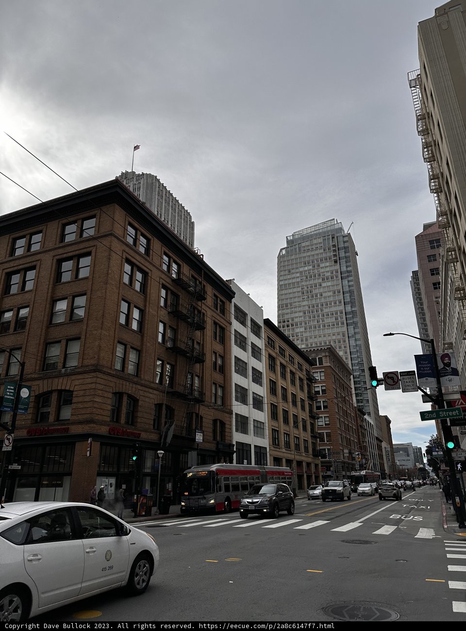 A vibrant cityscape amidst a cloudy sky