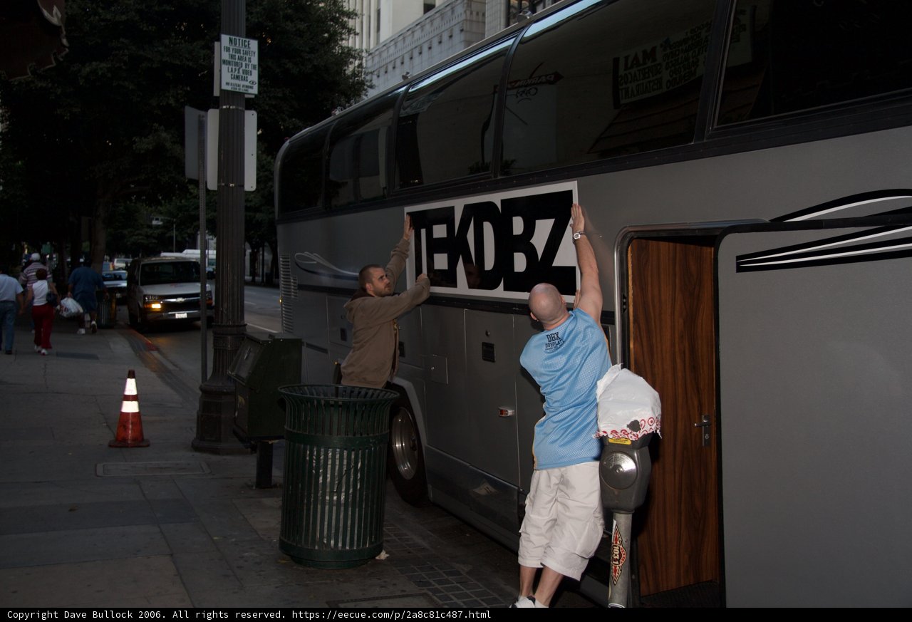 Putting Up a Sign on a Bus