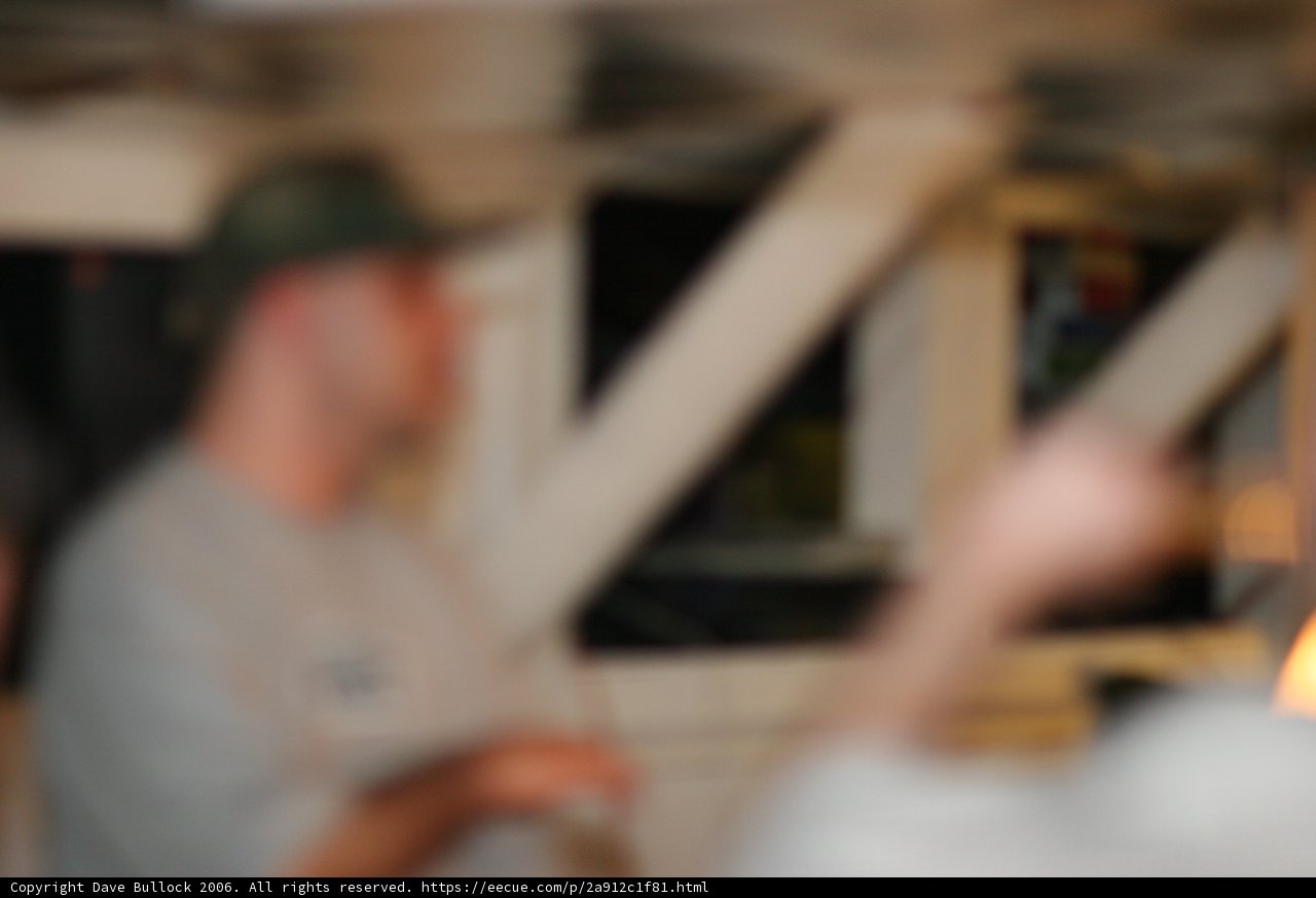 Blurry man standing by the window