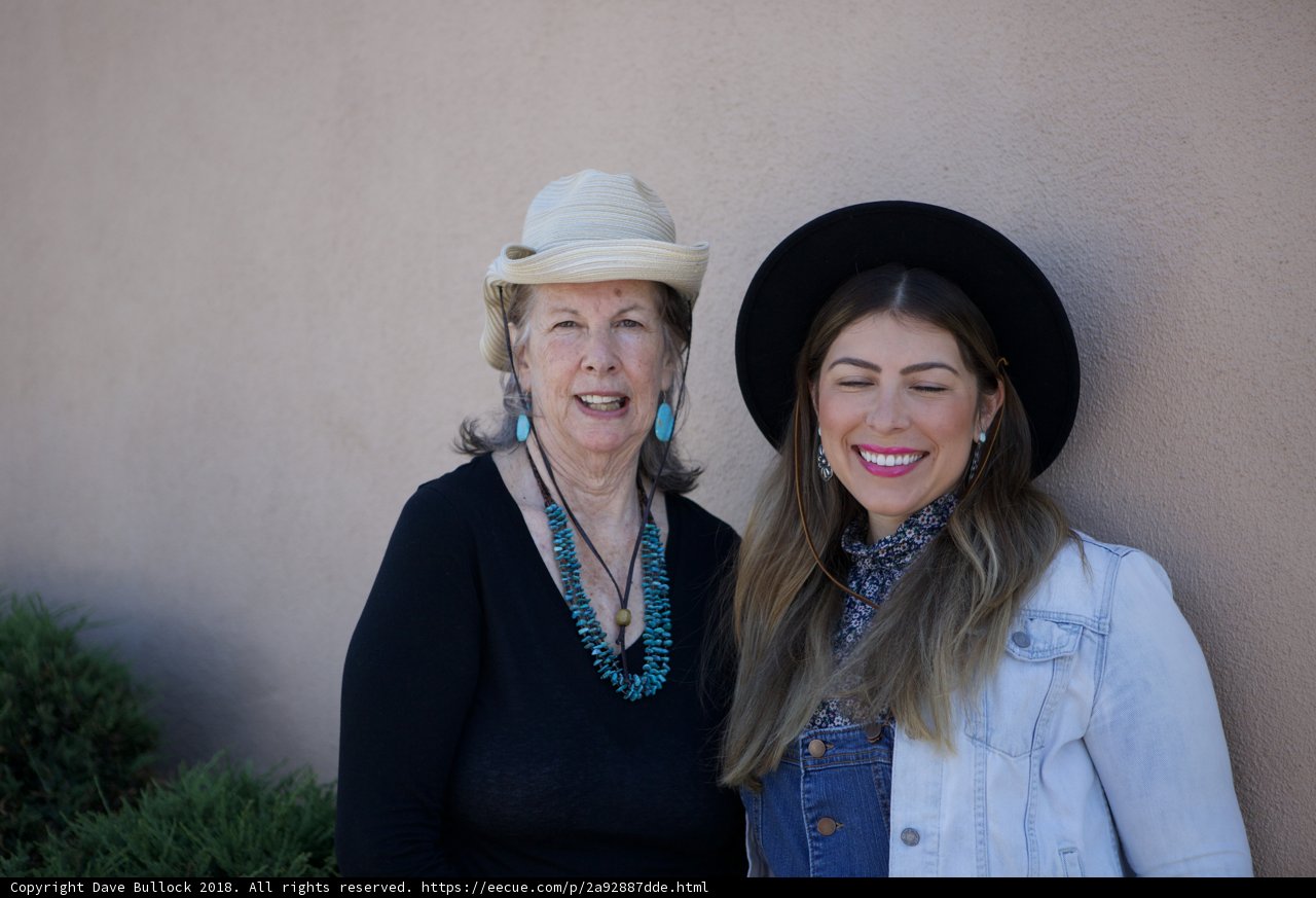 Two Ladies Donning Western Hats