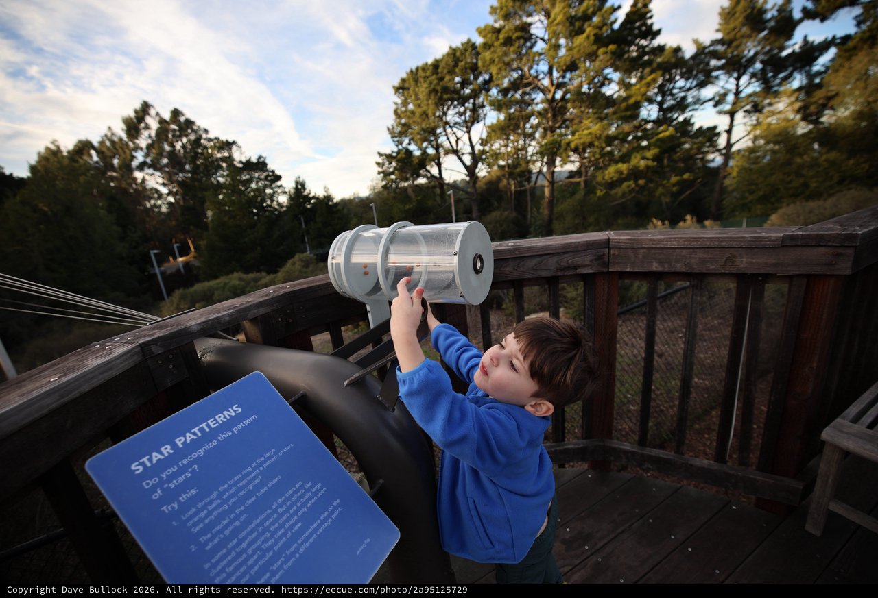 Young Explorer Using Star Pattern Viewer at Observatory Deck