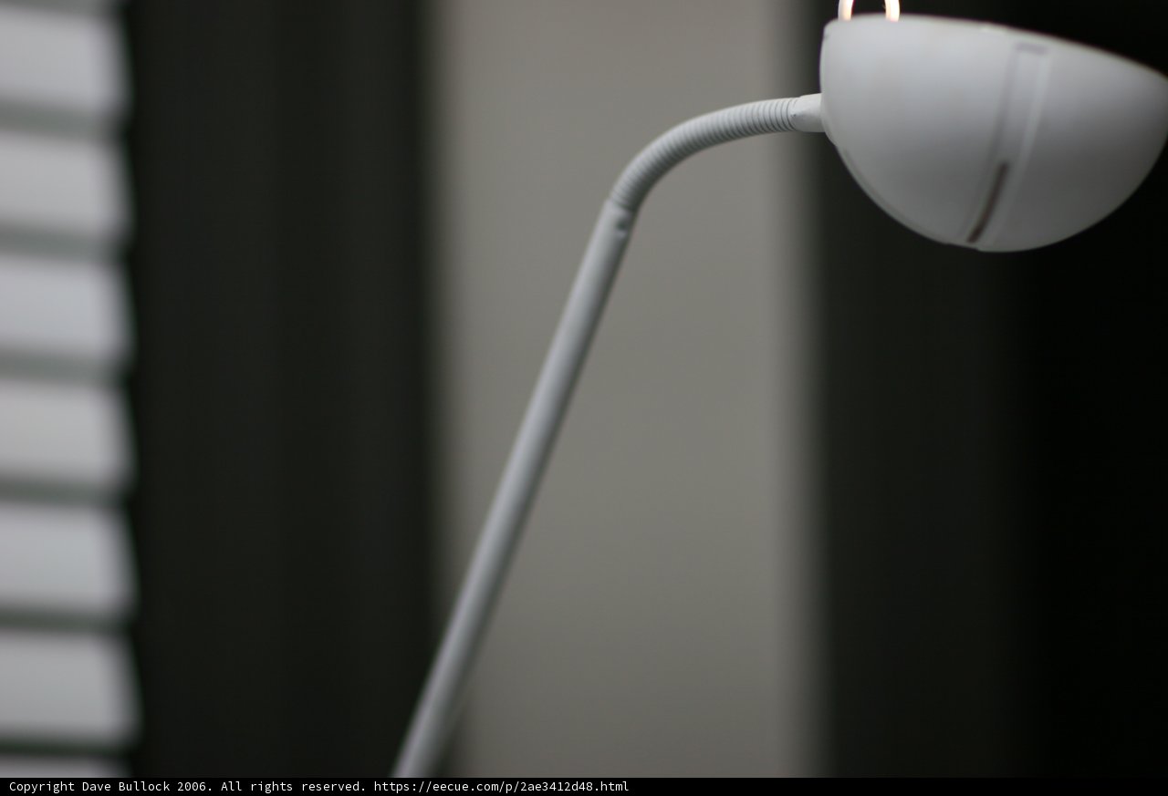 White Lamp with White Cord Illuminating the Room