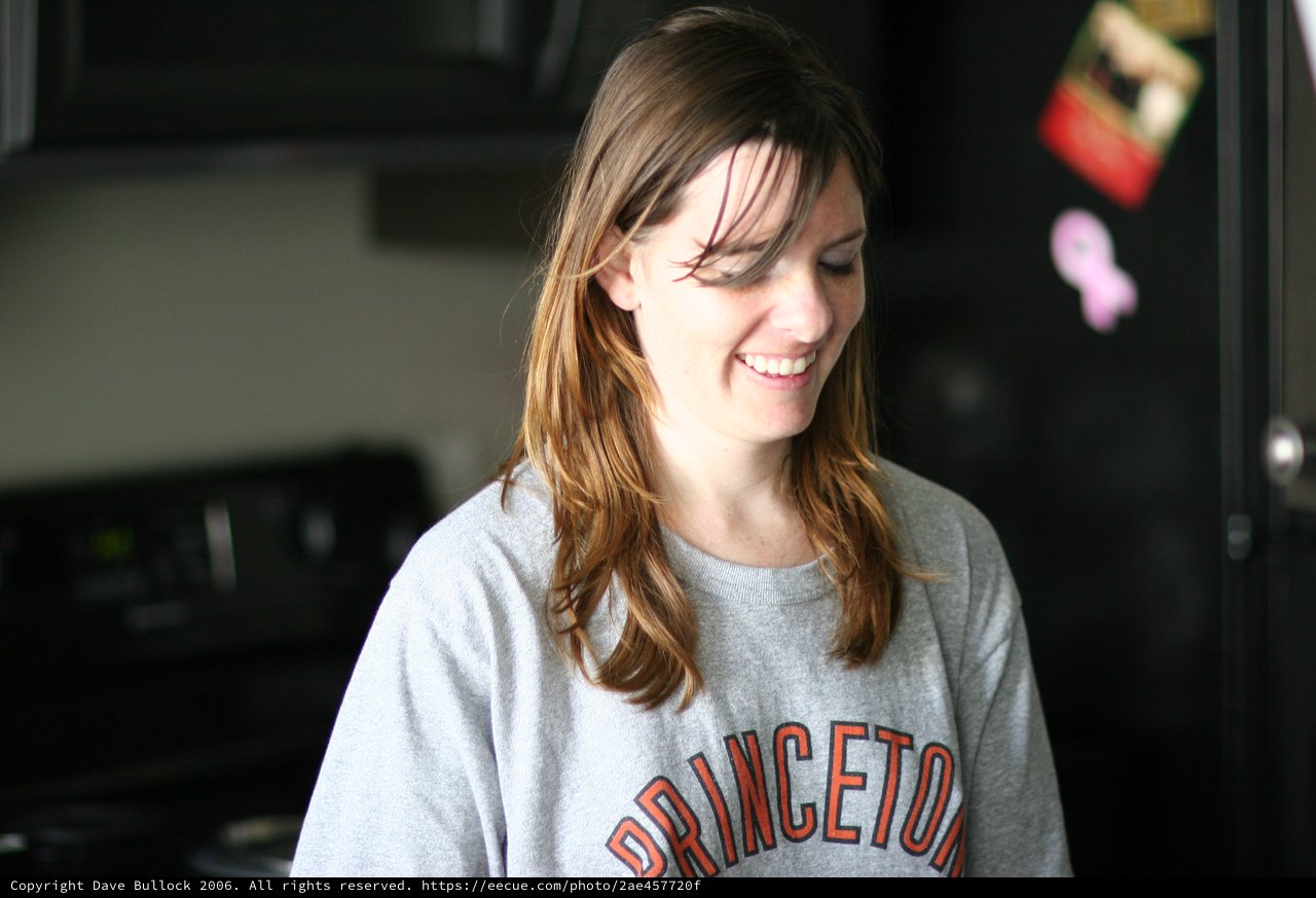 Smiling Young Woman in Princeton Sweatshirt at Home
