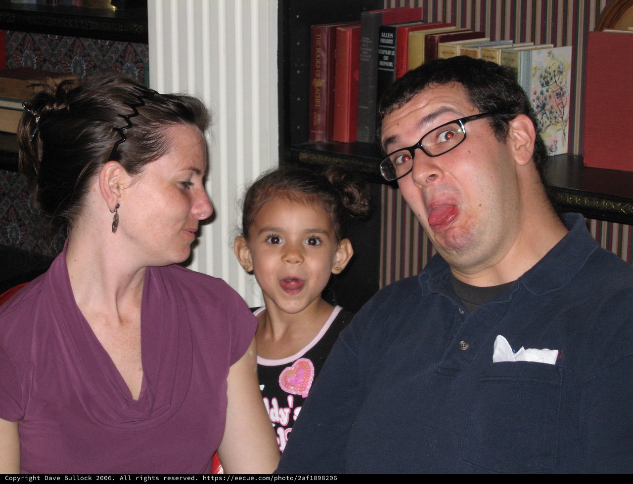 Family Makes Silly Faces at Wedding Rehearsal Dinner