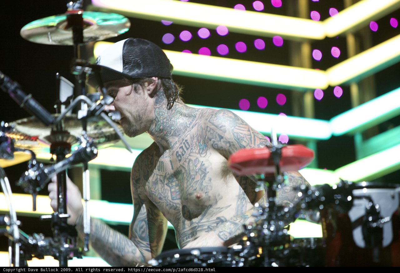 Tattooed Drummer Takes Center Stage