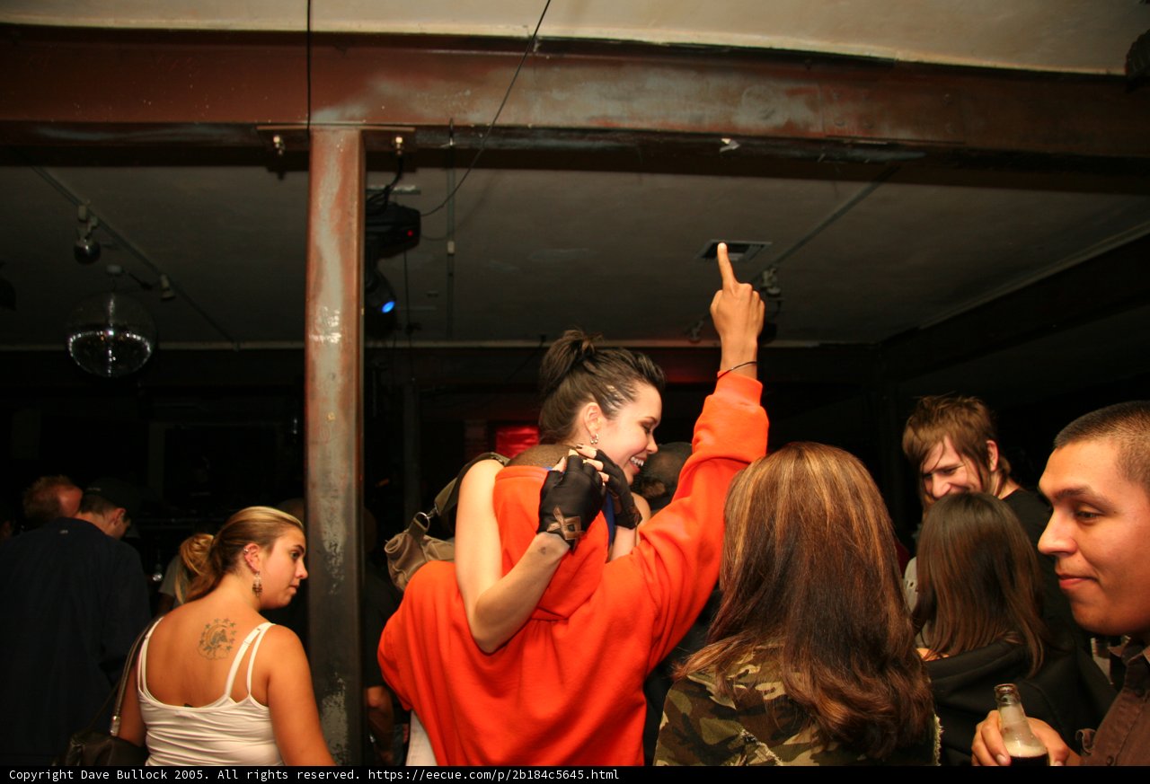 Bride being held up by the groomsmen