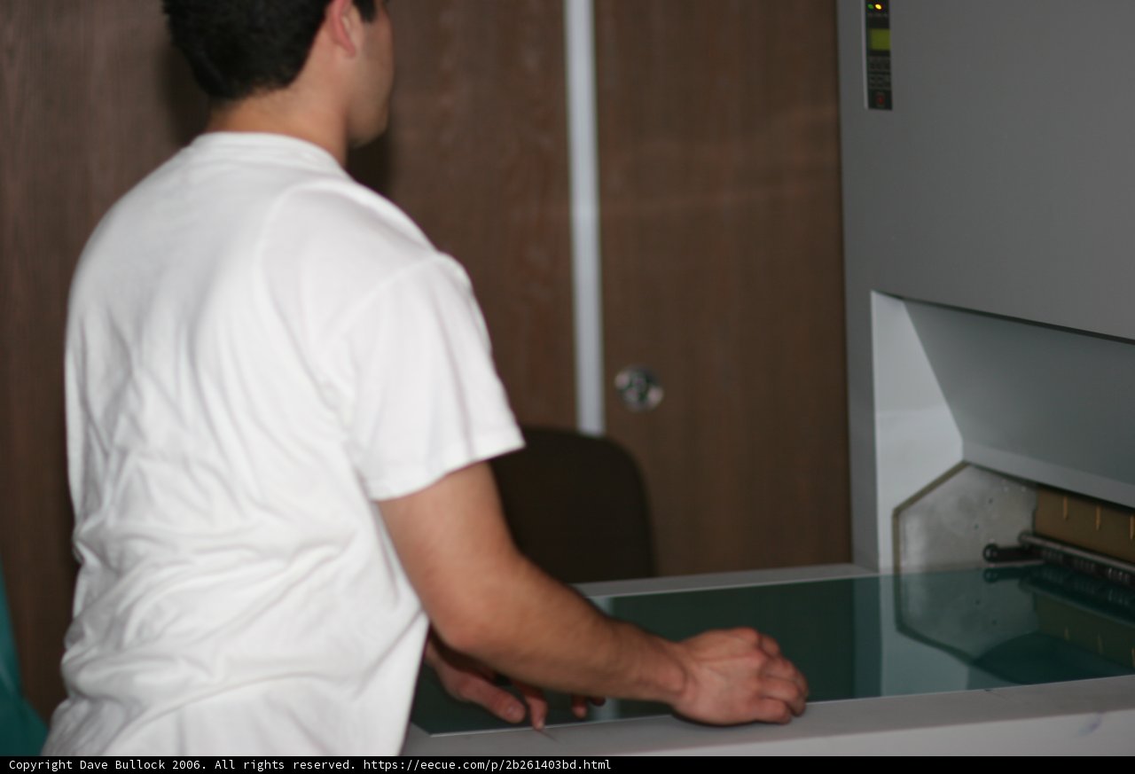 Man operating office machine