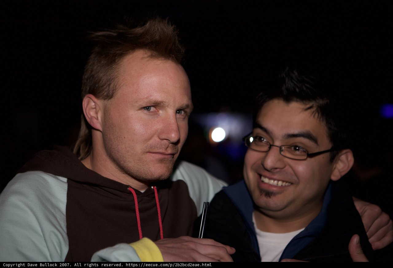 Two Men Sporting Knitwear Smile for the Camera