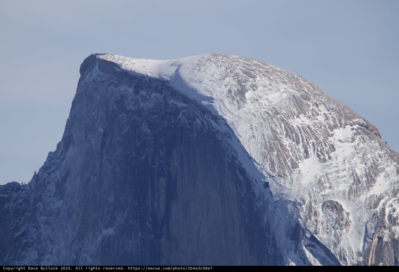 Half Dome's Snow-Covered Summit in Winter Light