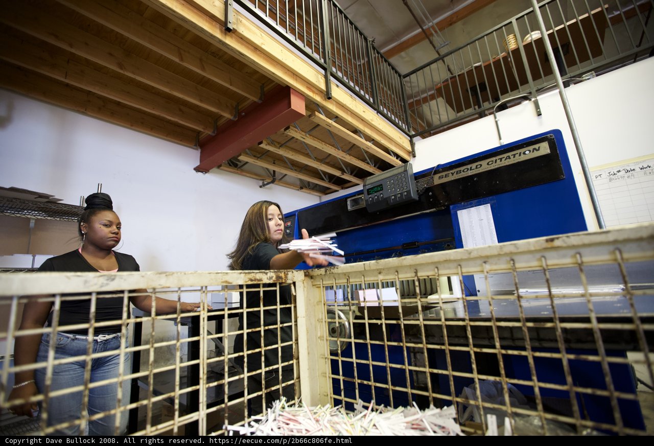 Women in a Warehouse with a Machine