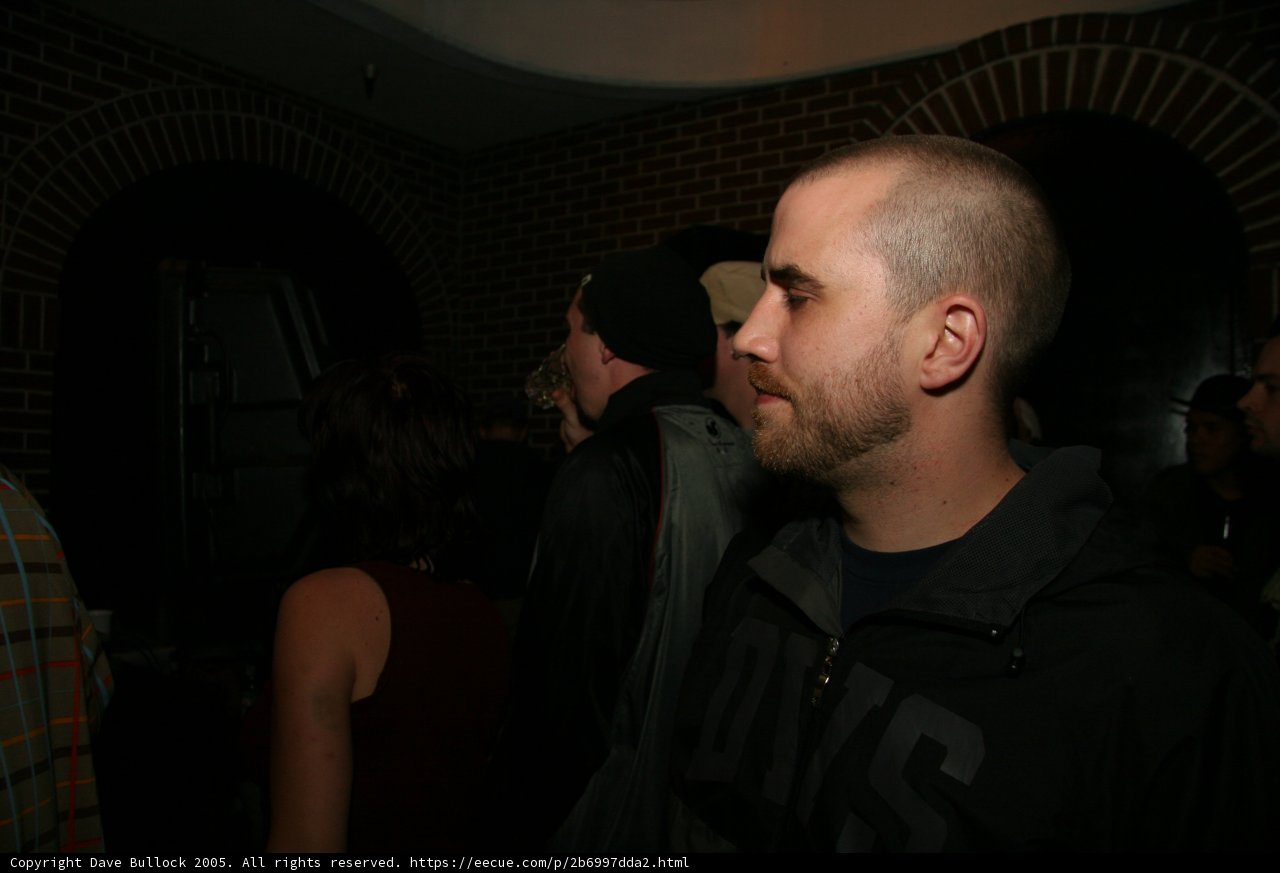 Shaved Head and Sleek Black Jacket