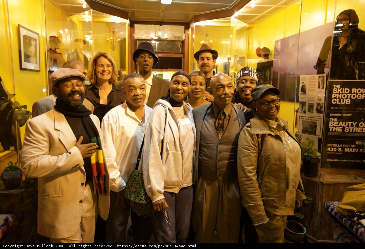 A Group of Art Enthusiasts Strike a Pose in Front of Exhibition
