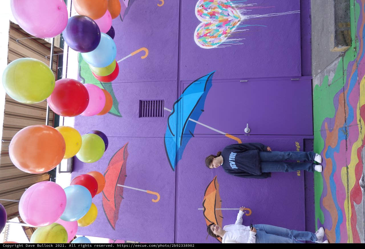 Colorful Balloon Installation with Umbrella Street Art