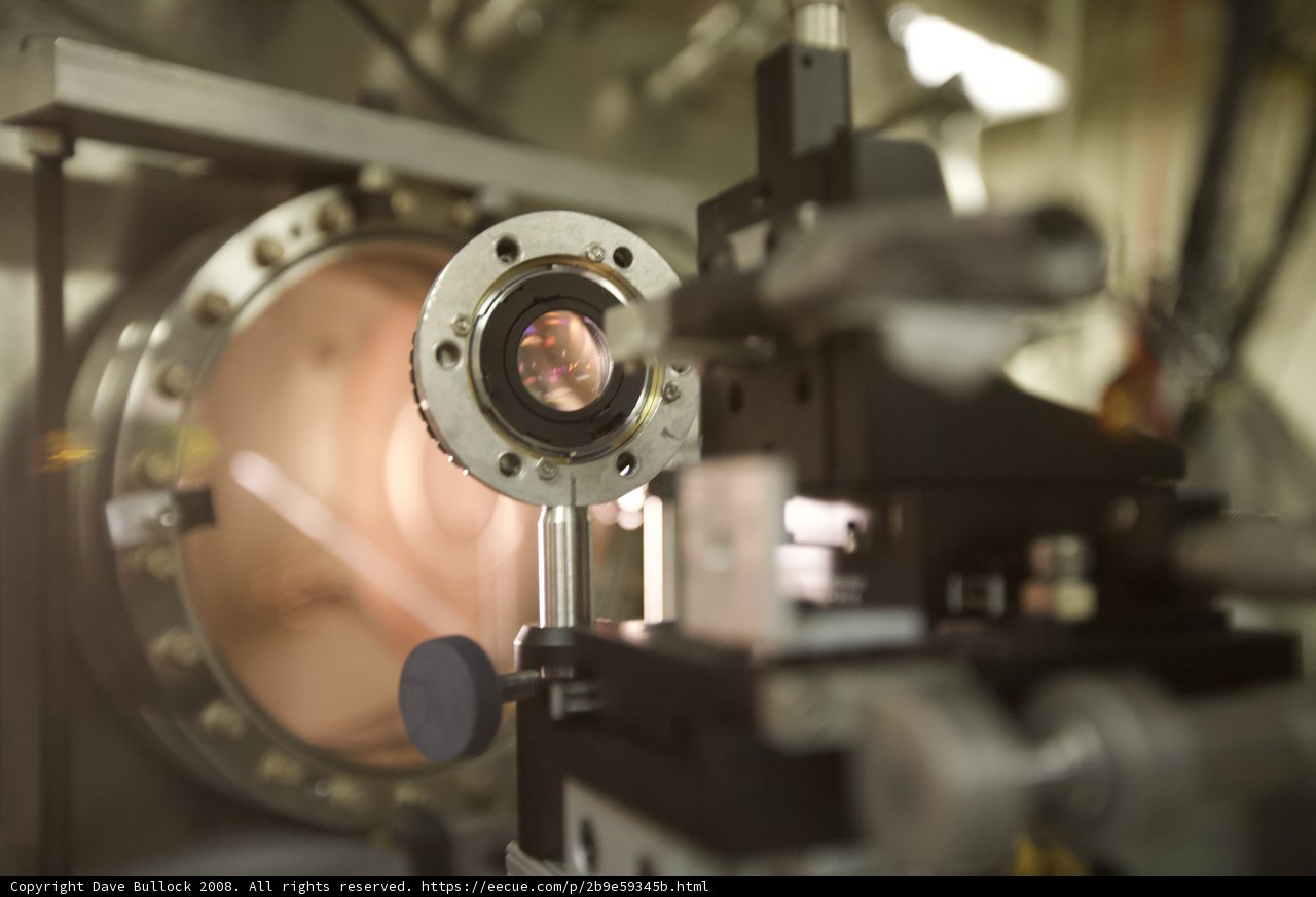 A Close-up of the Camera Lens in a Bustling Lab
