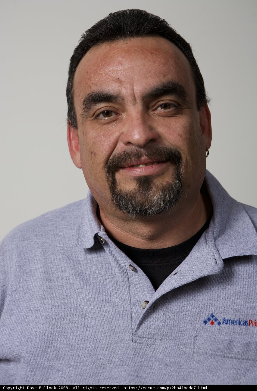 Gray-Shirted Man with a Beaming Smile