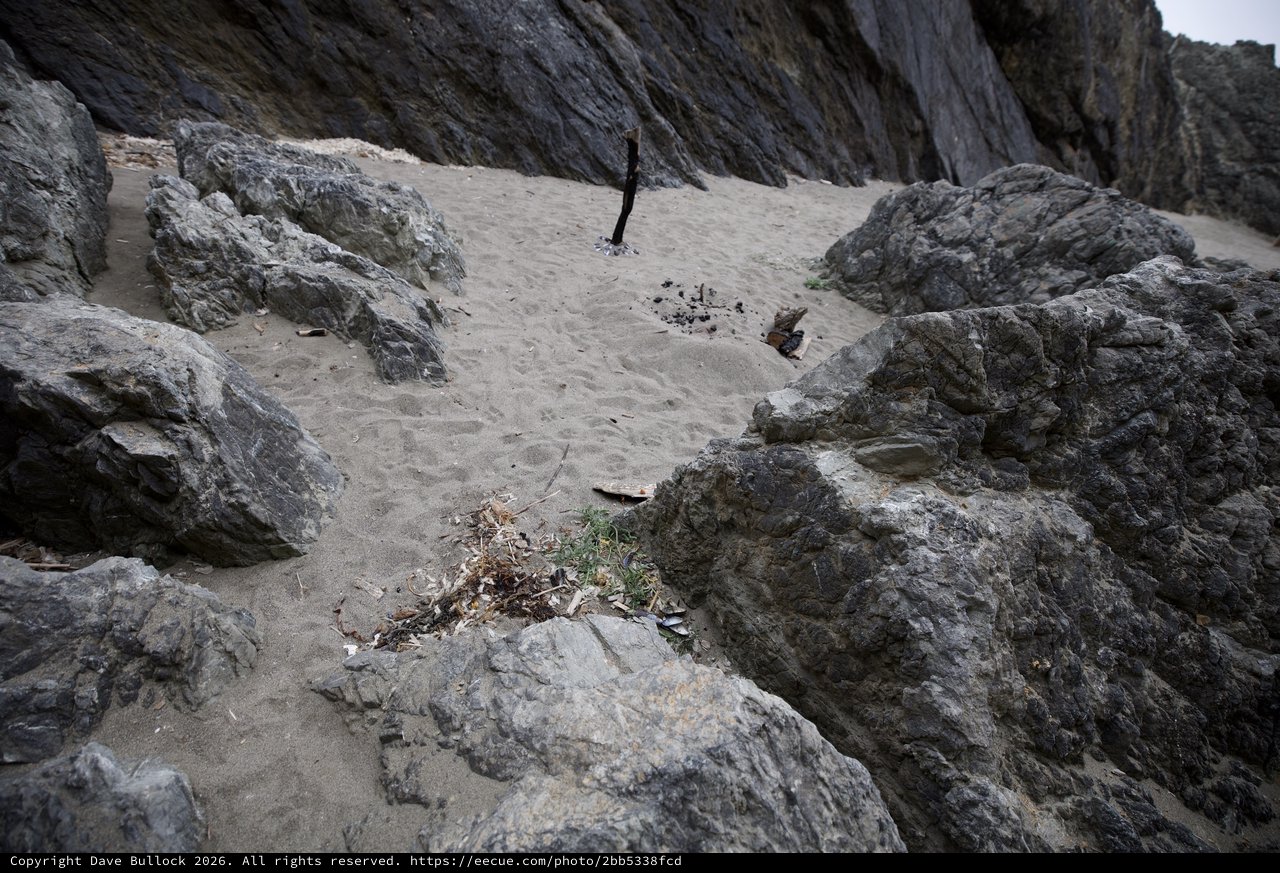 Rocky Cove Beach with Remnants of Campfire