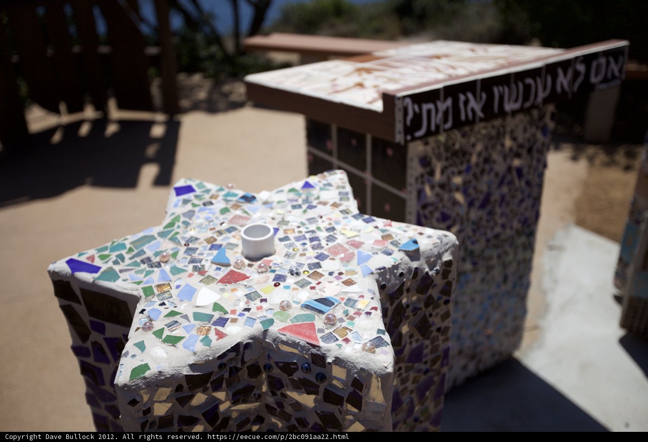 Mosaic Star on Bench in Front of Sign
