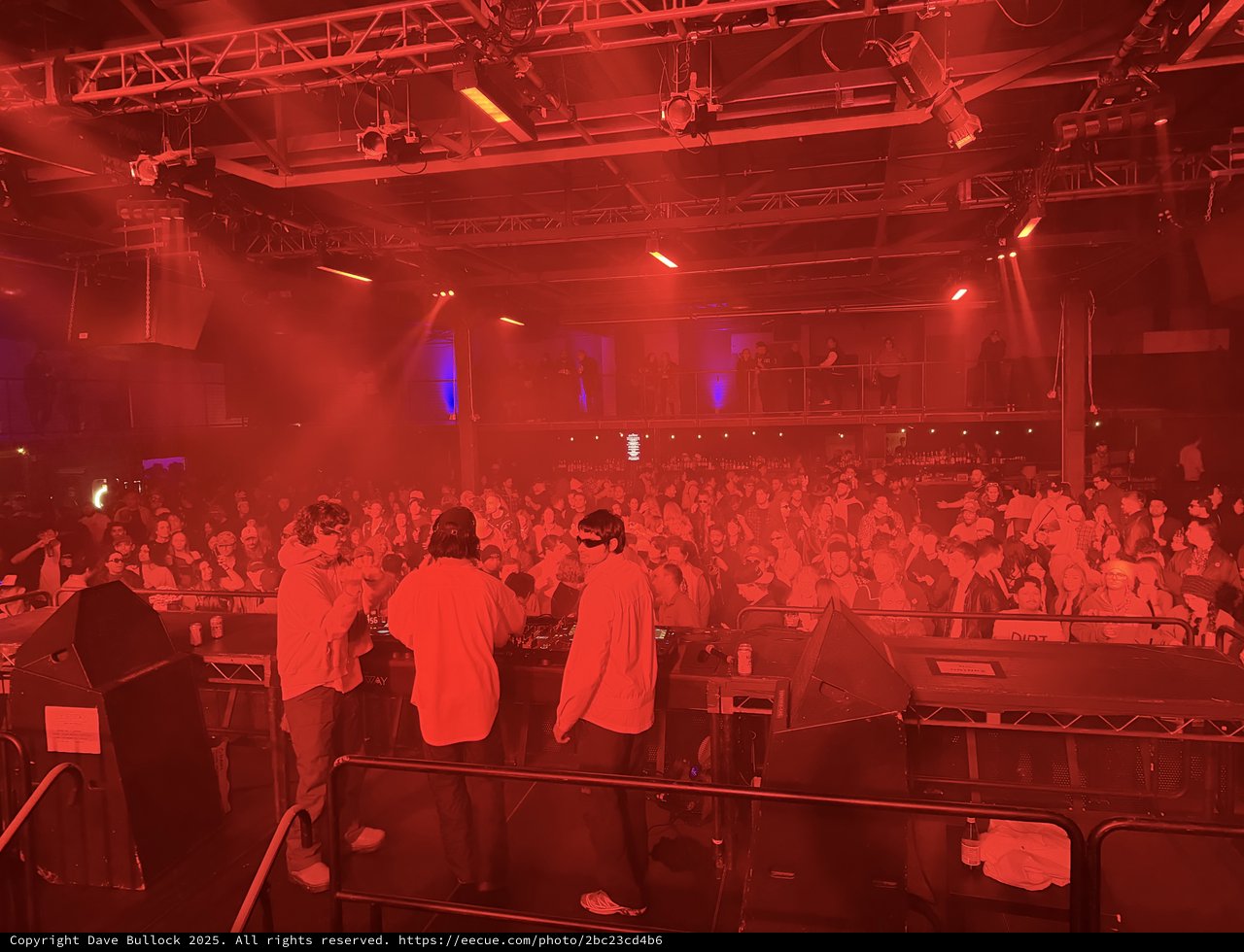 Electronic Music Event with Intense Red Stage Lighting