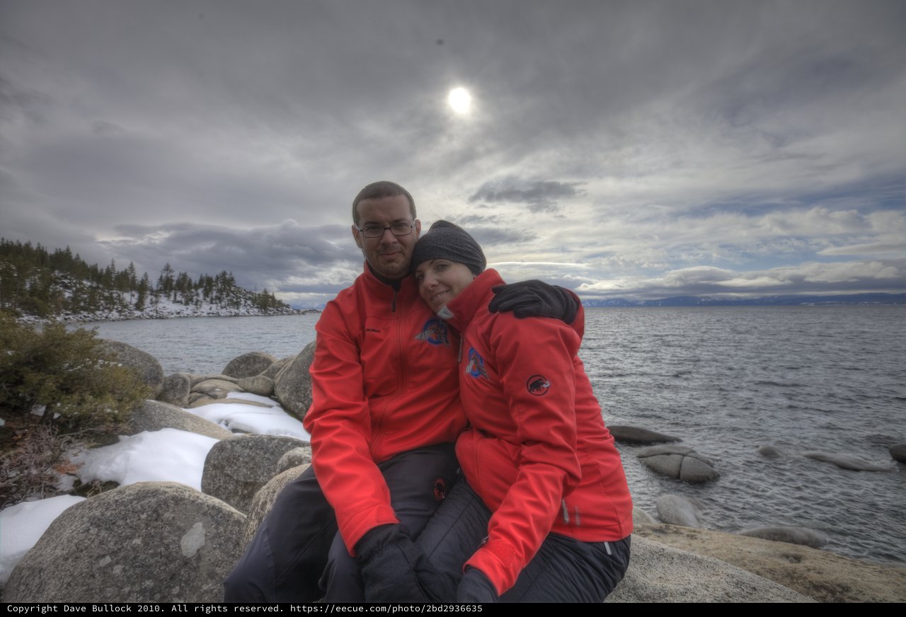 Couple Embracing at Lake Tahoe's Winter Shoreline