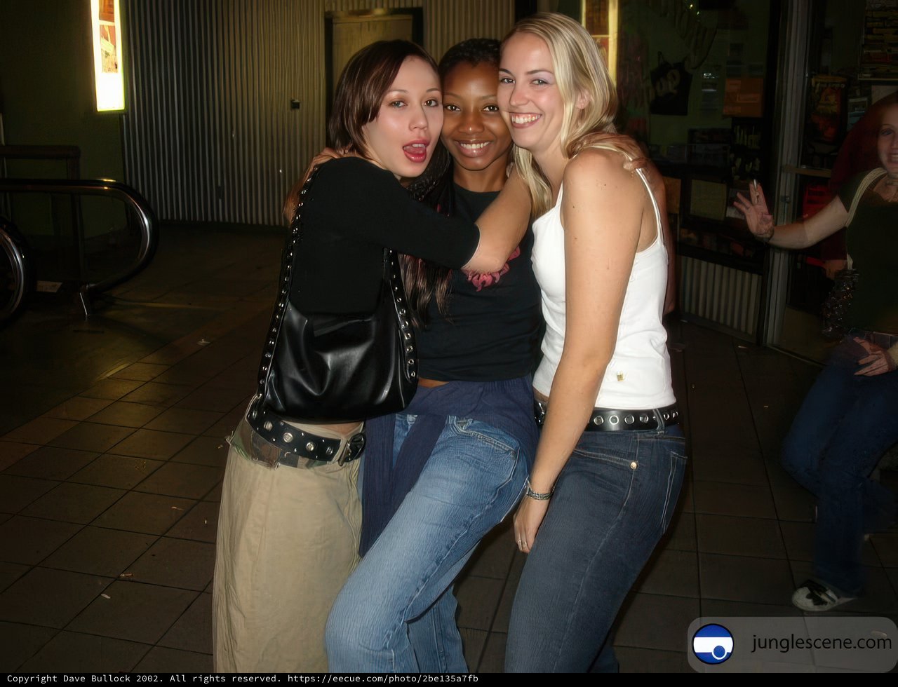 Three Women Strike a Pose for the Camera