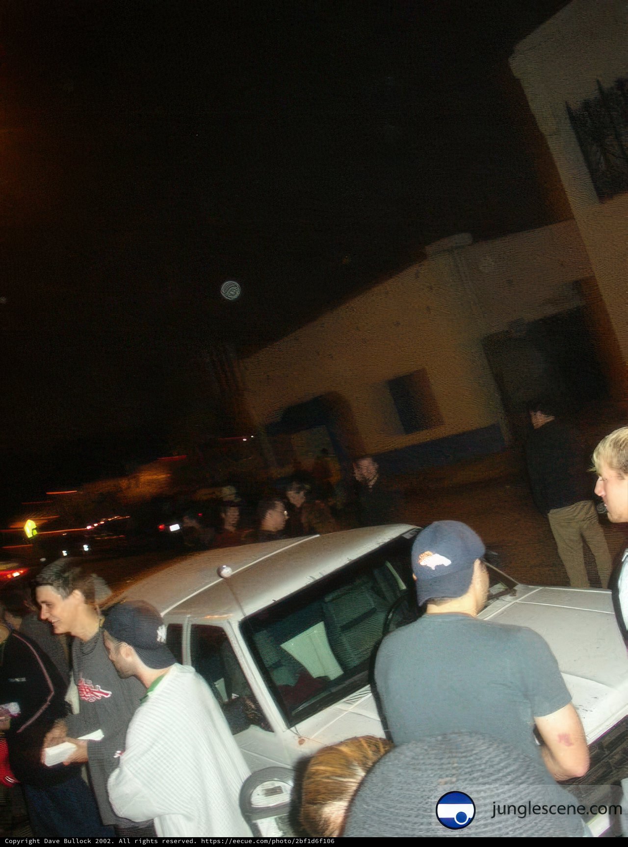 Nighttime Gathering by the Car