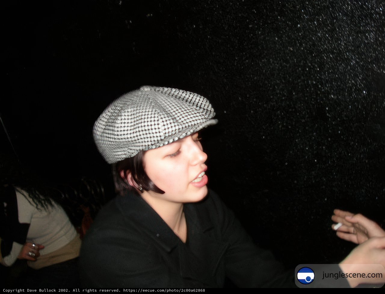 Stylish Woman in Black Jacket and Hat