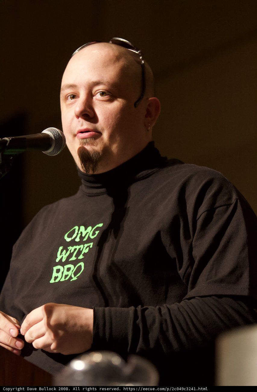 Bald Man Takes Charge of the Crowd