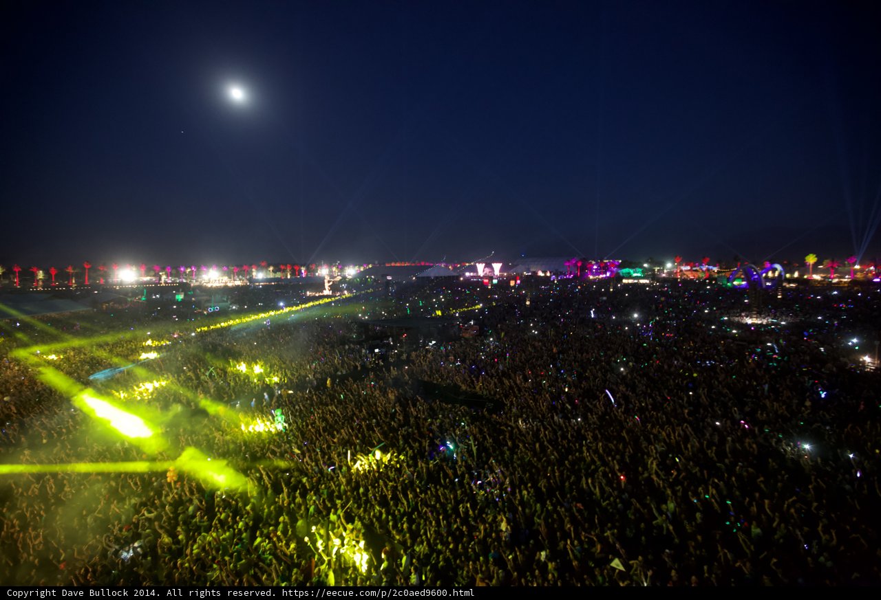 Illuminated Concert Crowd under Full Moon