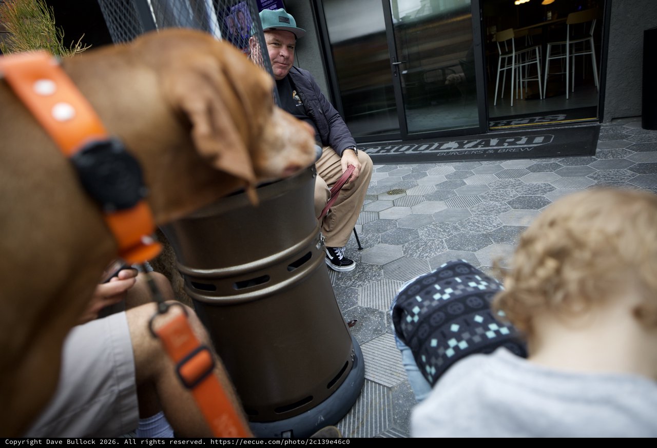 Urban Gathering Around Public Bench Outdoors