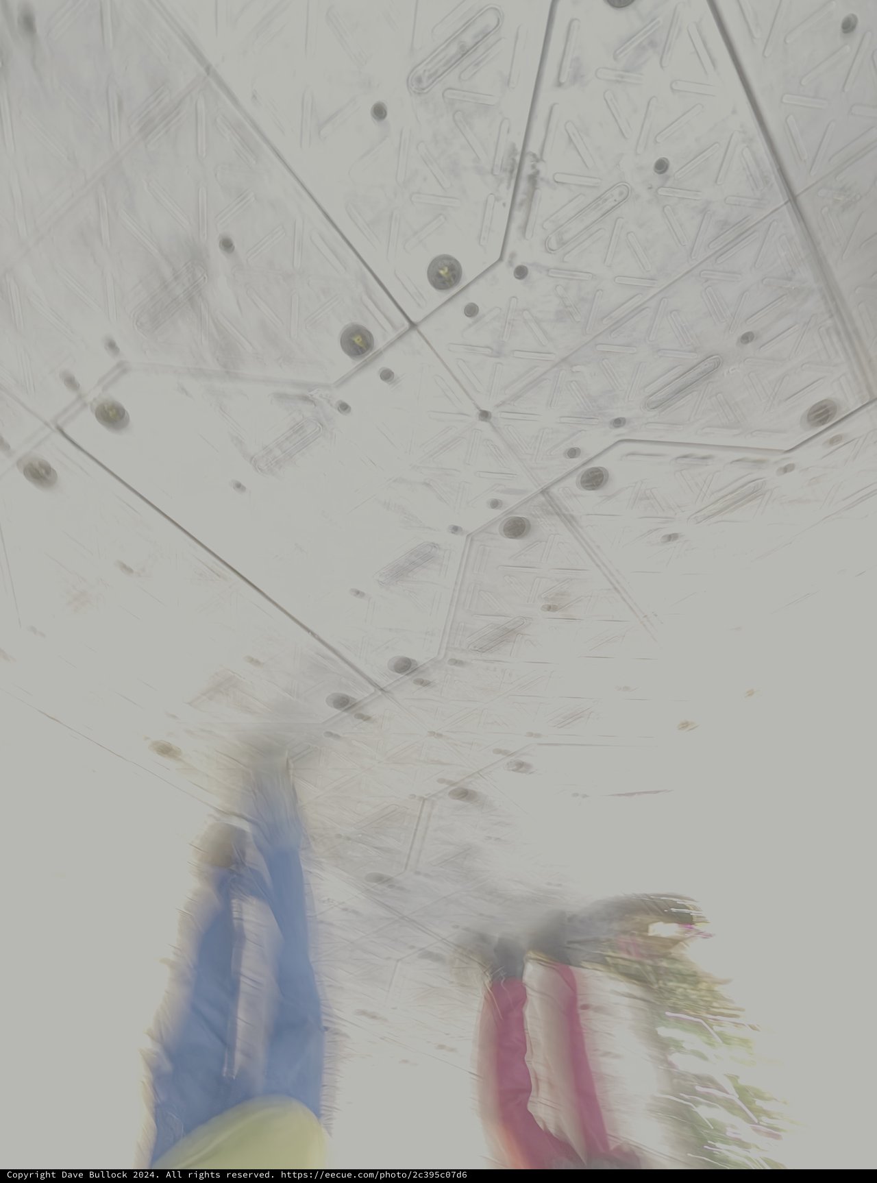 Motion Blur Under Ornate White Ceiling