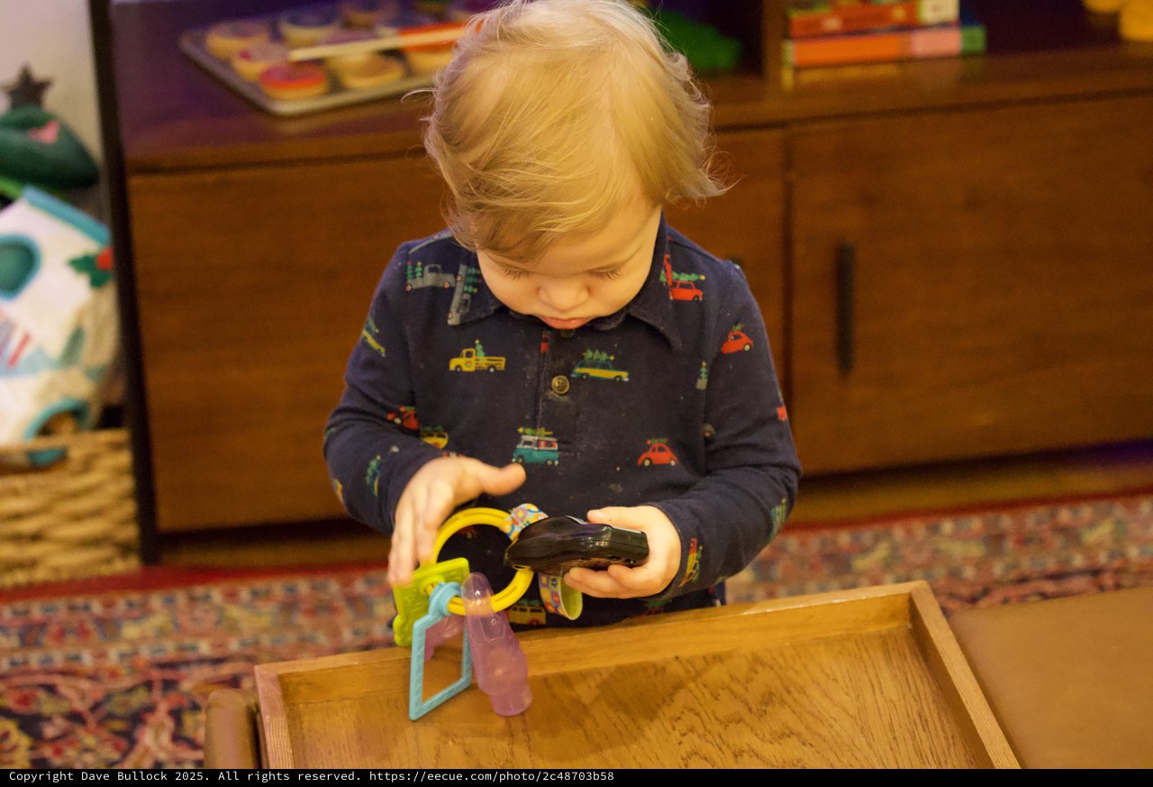 Toddler Playing with Toys on Christmas Eve