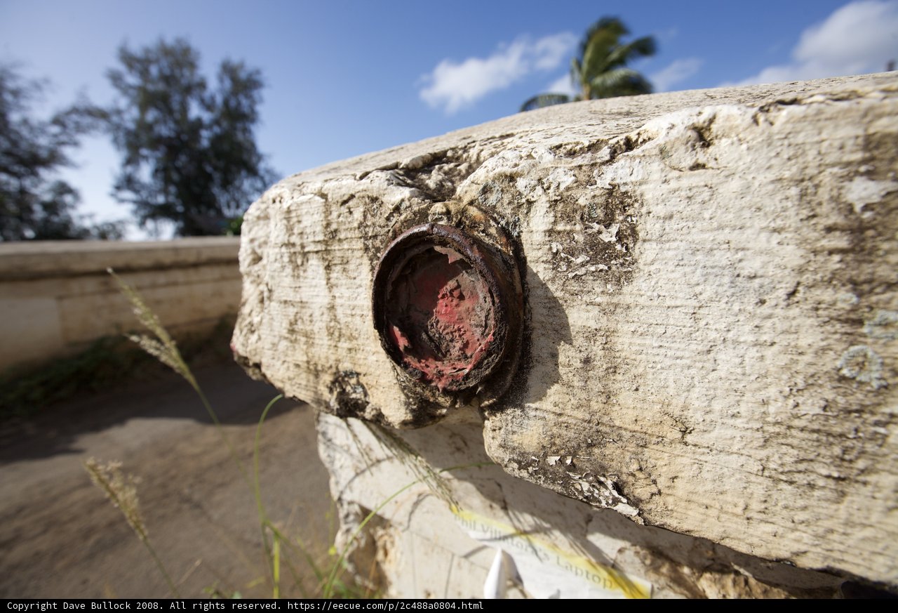 Red Button on Cement Wall in Hawaii