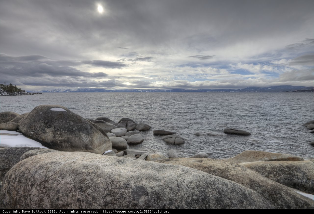 Rocky Shoreline with Ocean and Mountain View