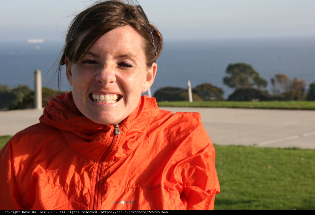 Windswept Woman Smiling by the California Coast