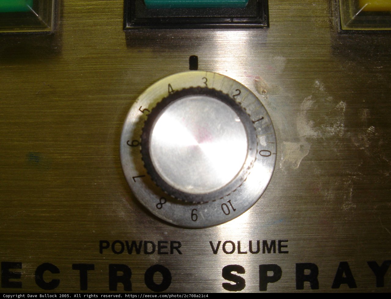 Metallic Control Knob on a Metal Wall