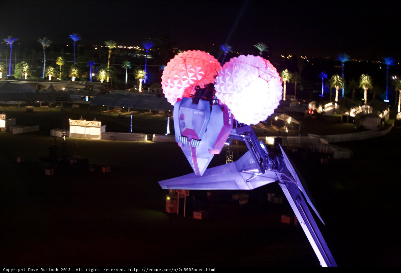 Lighted Balloon Shines Above Cityscape
