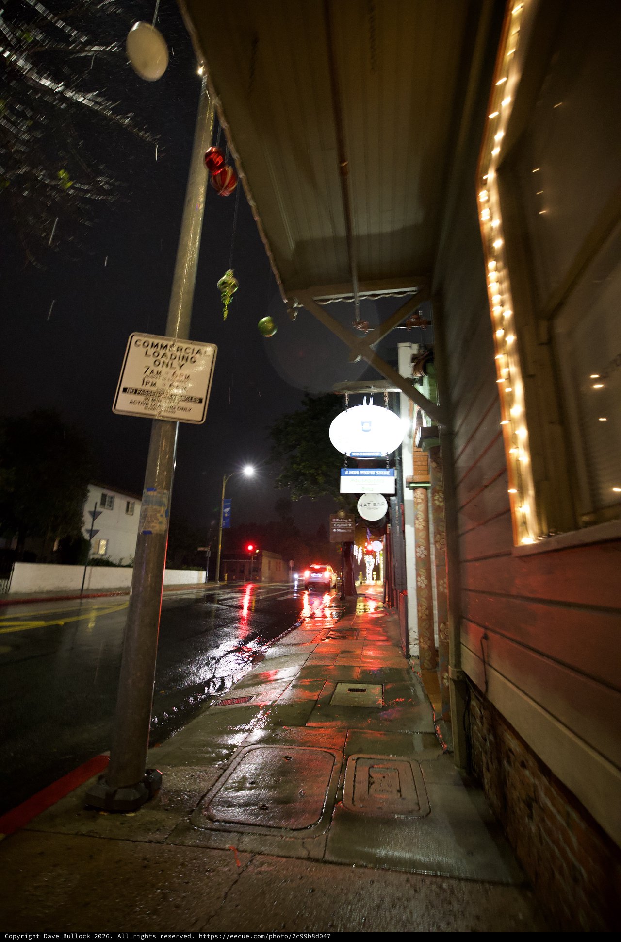 Rainy Night Street Scene with String Lights