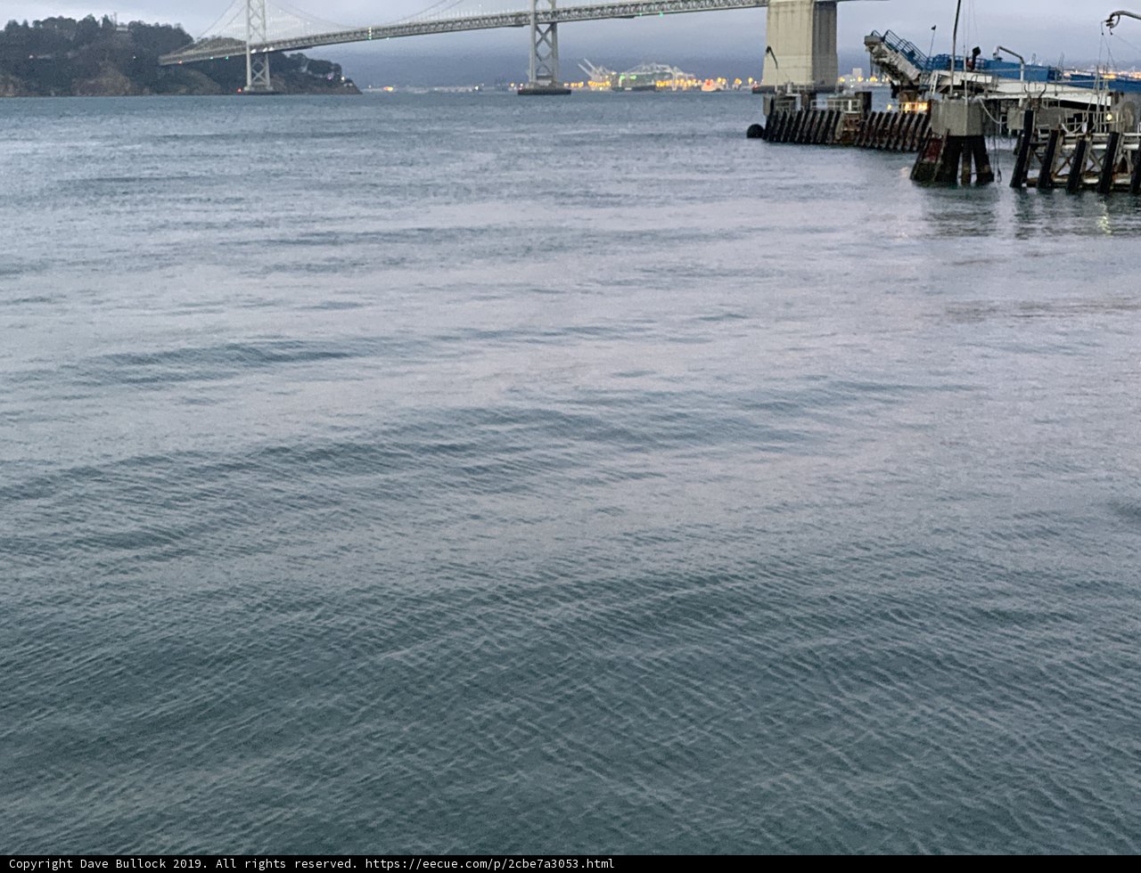 Boat sailing under the bridge